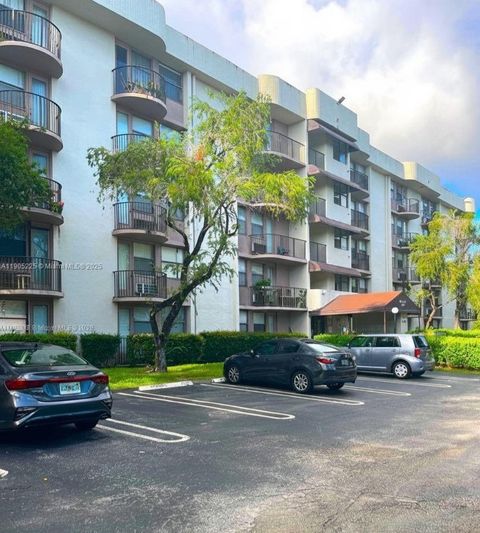 Photo of 2701 Riverside Dr #203-B, Coral Springs, FL 33065 (MLS # A11905225)