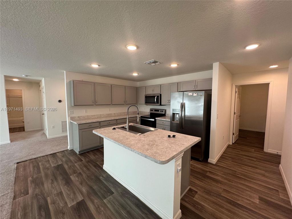 Photo of 314 SW Ray Ave, Port St Lucie, FL 34983 (MLS # A11971493)