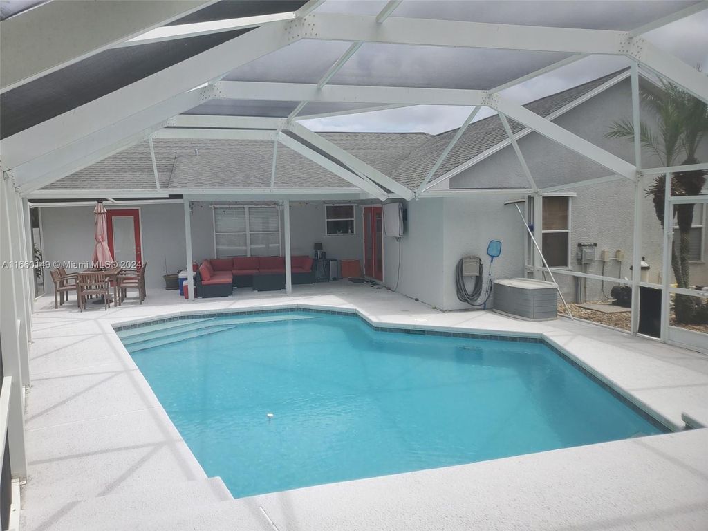 Photo of 224 SW Uneeda Pl, Port Saint Lucie, FL 34953 (MLS # A11660149)