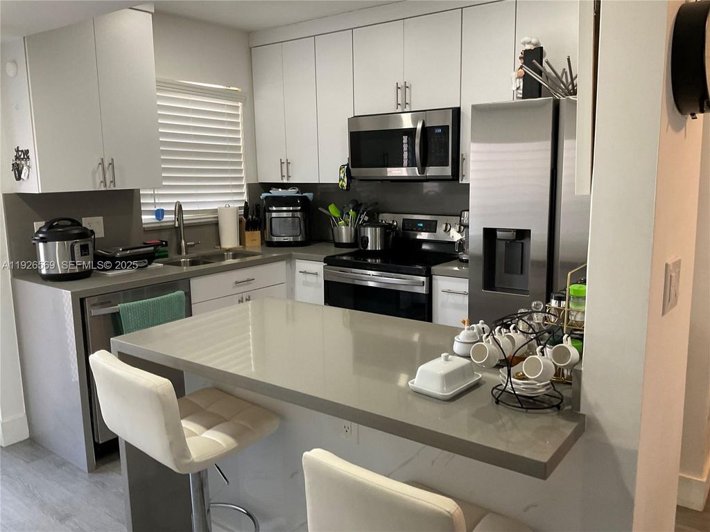 Photo of 9010 Sunrise Lakes Blvd #304, Sunrise, FL 33322 (MLS # A11926569)