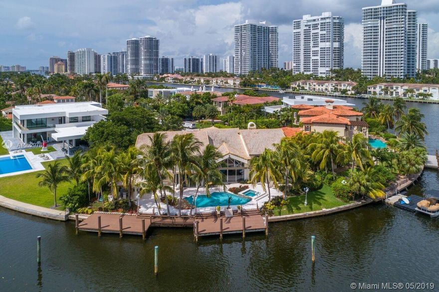 PRESTIGIOUS GOLDEN BEACH-GATED COMMUNITY-PRIVATE BEACH. MAGNIFICENT 6 BEDROOM, 6 1/2 BATH FAMILY HOME WITH OVER 8,200 SF ON EXCLUSIVE NORTH ISLAND CUL DE SAC. SPECTACULAR POOL AREA WITH SUMMER KITCHEN, TWO DOCKS AND WIDE WATER VIEWS! GRAND ENTRY WITH HIGH CEILINGS AND MARBLE FLOORS THROUGHOUT. SEPARATE GUEST SUITE WITH OFFICE. GOURMET KITCHEN WITH STAINLESS STEEL APPLIANCES AND GRANITE TOPS. 159 FT OF PRIME WATER FRONTAGE ON OVERSIZE 14,709 SF LOT.