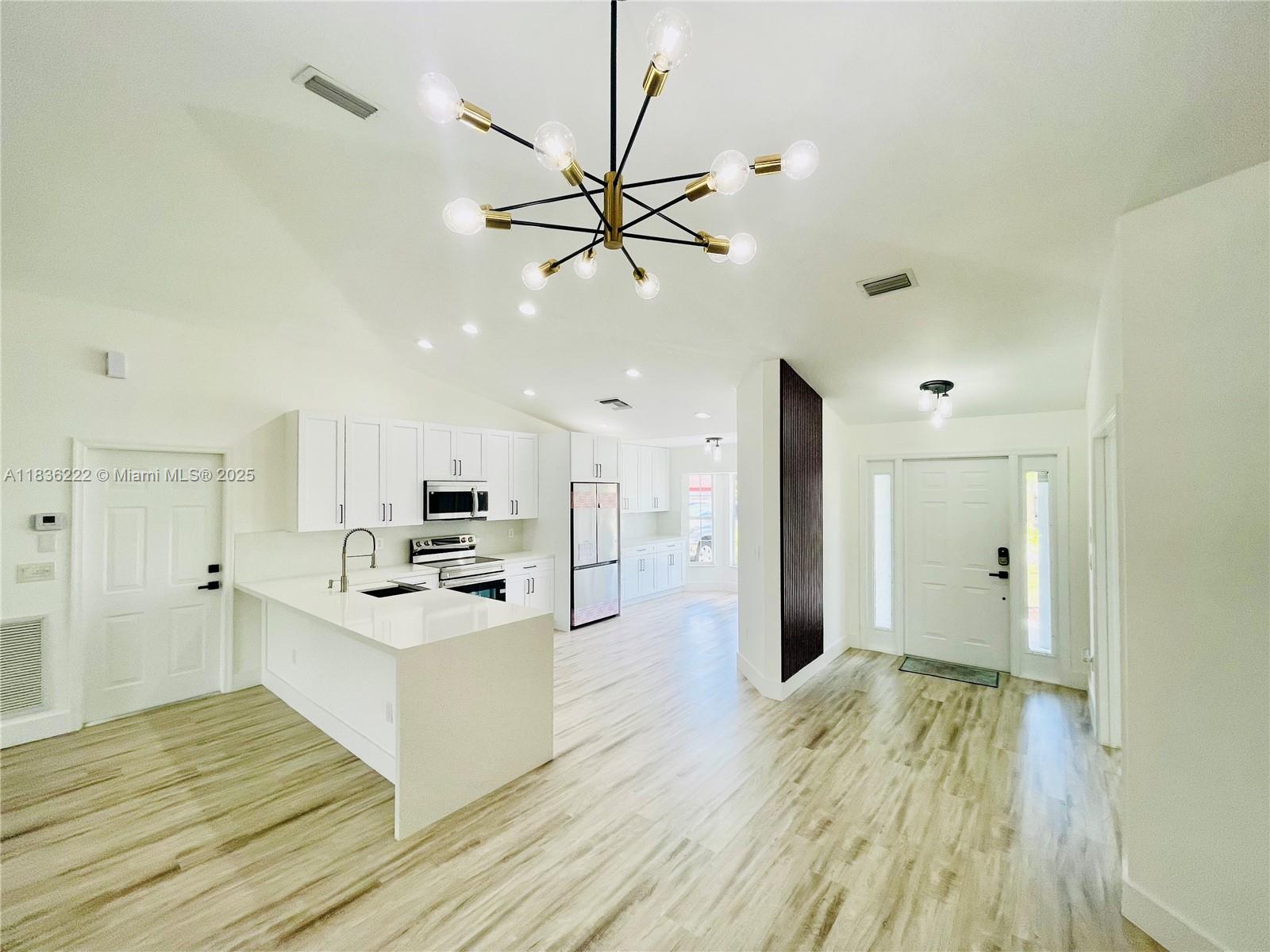 Welcome to your dreamed house! Beautiful 4bd/2 bath home located in PSL, two minutes from Florida Turnpike, close to many recreational areas, beaches and boat ramps. The house features new (2025) metal roof, floors, bathrooms, wood kitchen cabinets, quartz countertops and brand new appliances.