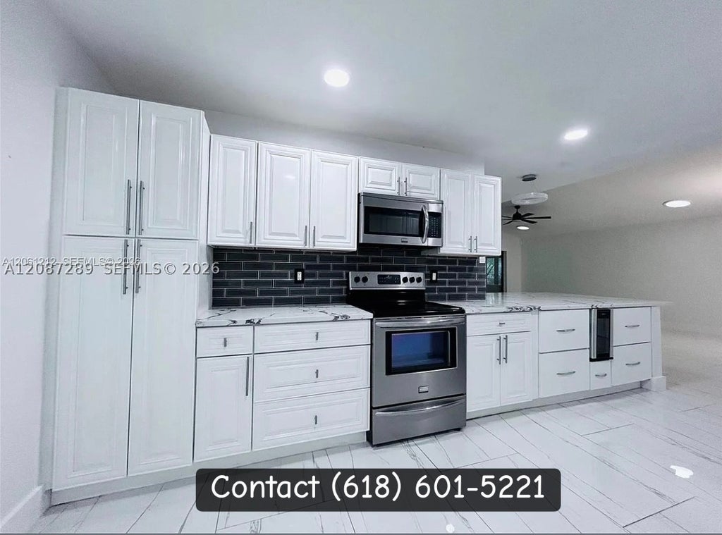 Photo of 2540 Calamondin Cir, Coconut Creek, FL 33063 (MLS # A12087289)