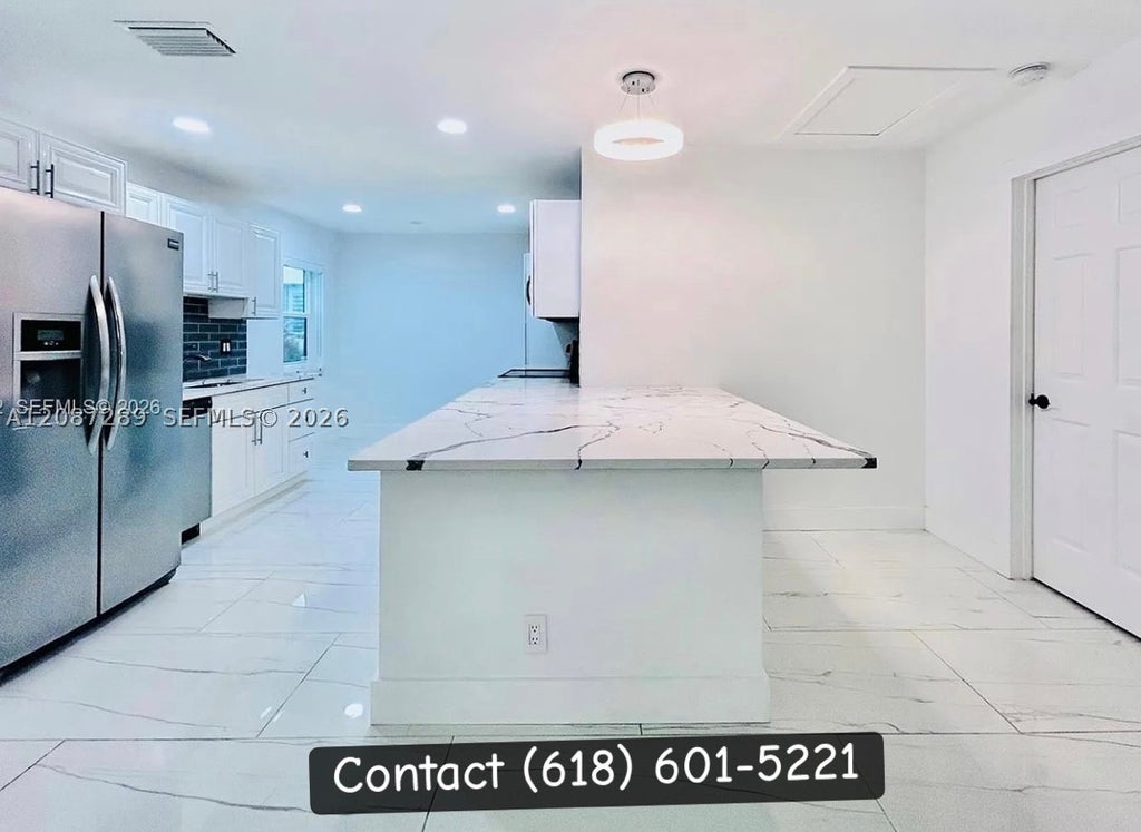Photo of 2540 Calamondin Cir, Coconut Creek, FL 33063 (MLS # A12087289)