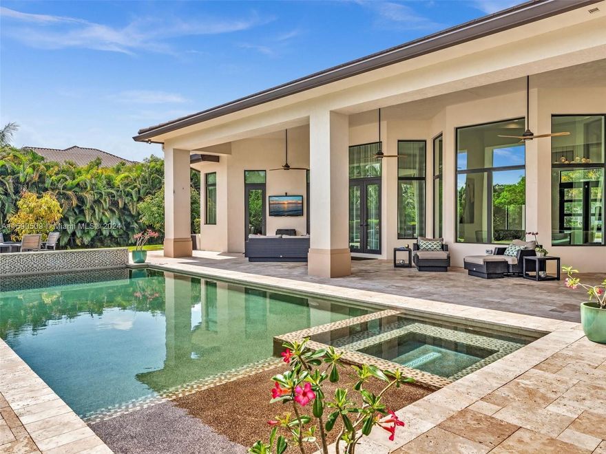 Timelessly Elegant Contemporary Home! Create your memories in this exquisitely detailed residence nestled in exclusive gated neighborhood where luxury and privacy blend. Be captivated by the sophisticated modern yet casual feel of this stunning 4 bed/4 bath + office home which sits on a lushly landscaped acre. Backyard oasis is ideal for relaxing in the salt pool/spa or dining alfresco around the fully equipped outdoor kitchen. Step inside and fall in love with soaring ceilings and abundance of natural light. The custom chef's kitchen's expansive center island w/seating or 8 and overlooks the spacious family rm w/bonus space for additional dining or game area. Master suite w/sitting area, coffee bar and spa-like bathroom. Oversized 3 car garage and large motor court for additional parking.