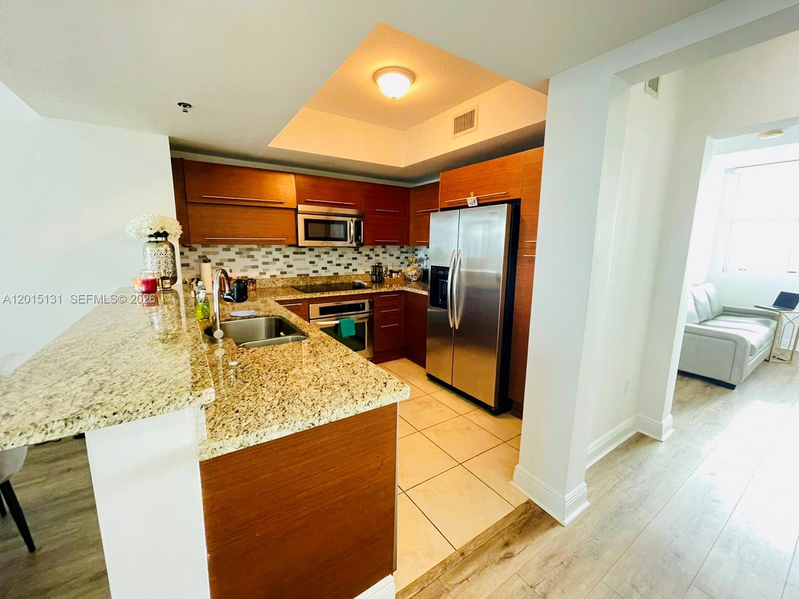 TAO SAWGRASS CONDOMINIUM - Residential Lease