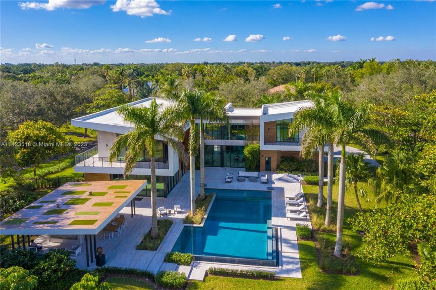 A one of kind MODERN MASTERPIECE that has been developed with incredible detail exemplifying the true meaning of luxury. A Contemporary home by internationally known Varabyeu Designs. Situated in the most exclusive gated communities in Weston, on a 1.60 acre lot, this unique home overlooks a spectacular long open lake view. State of the art features: 15 HD security cameras, smart home savant system controlling all lights, surround system throughout home & pool & cameras, accessible from anywhere in the world. Full house generator & top of the line appliances w/ a expansive Butler's pantry, full outdoor kitchen/gazebo with cabana bath. The "resort" feel & architect of this home is one to see. An opportunity to own a piece of art in Weston. Custom Furnishings. Features sheet attached.