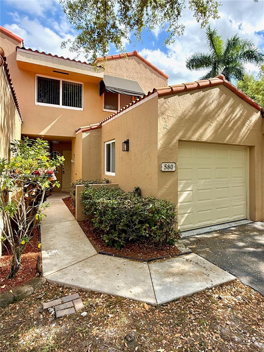 Price Reduced for this Rarely available 3-bed, 2.5-bath townhouse (with Garage) on a Cul De Sac in FHA/VA-approved Dahlia at Plantation! No assoc. application process! This Move-in ready gem is by a tranquil lake, features water proof flooring, SS appliances, kitchen w/ Quartz counter tops, modern bathrooms w/ dual sinks, walk in closets, screened-in patio, newer AC & Impact Windows. Enjoy the convenience of immediate rental options—perfect for investors or homeowners alike! Pool & play area included. The location is unbeatable, just minutes from major highways, shopping, dining, central park + entertainment. Pet friendly & family oriented. All ages are welcome! The monthly maint. includes: Roof repairs, exterior paint, landscape service, pool & clubhouse. Act fast!