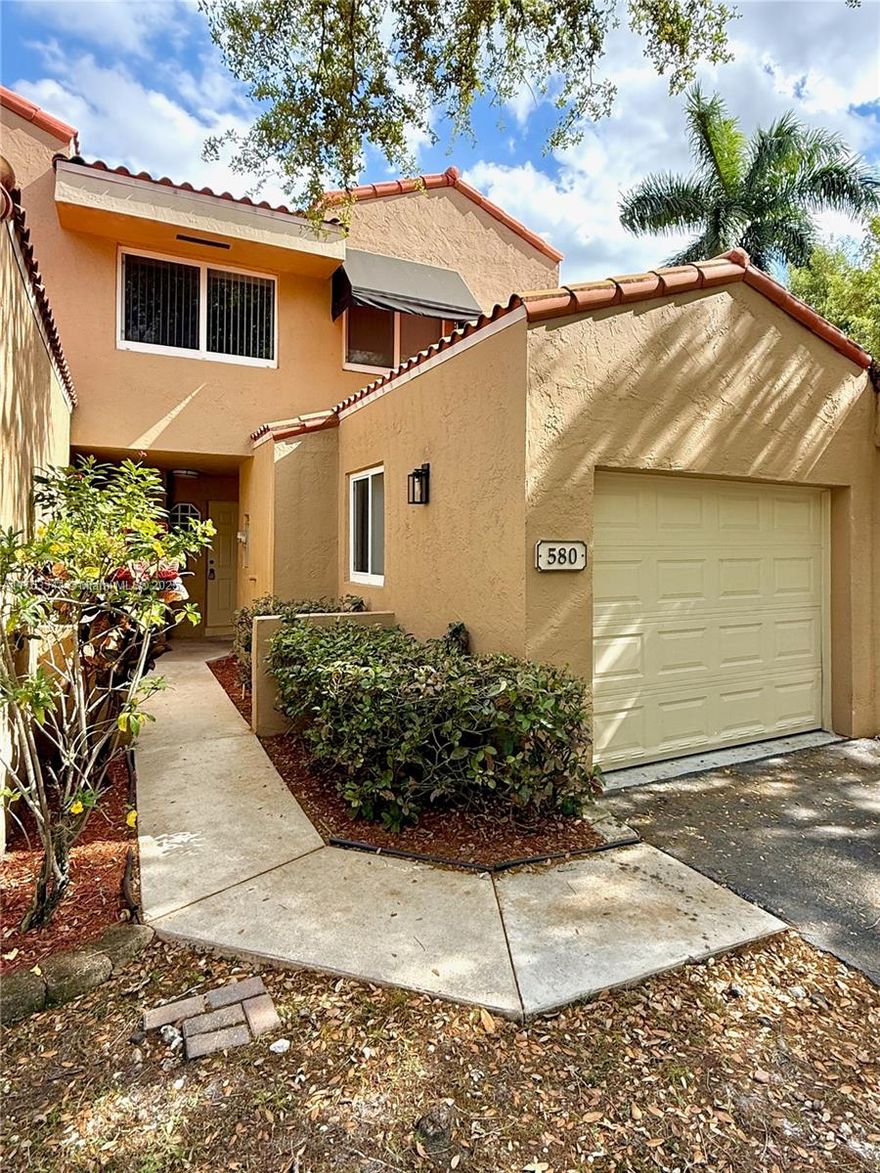 Price Reduced for this Rarely available 3-bed, 2.5-bath townhouse (with Garage) on a Cul De Sac in FHA/VA-approved Dahlia at Plantation! No assoc. application process! This Move-in ready gem is by a tranquil lake, features water proof flooring, SS appliances,  kitchen w/ Quartz counter tops, modern bathrooms w/ dual sinks, walk in closets, screened-in patio, newer AC & Impact Windows. Enjoy the convenience of immediate rental options—perfect for investors or homeowners alike! Pool & play area included. The location is unbeatable, just minutes from major highways, shopping, dining, central park + entertainment. Pet friendly & family oriented. All ages are welcome! The monthly maint. includes: Roof repairs, exterior paint, landscape service, pool & clubhouse. Act fast!