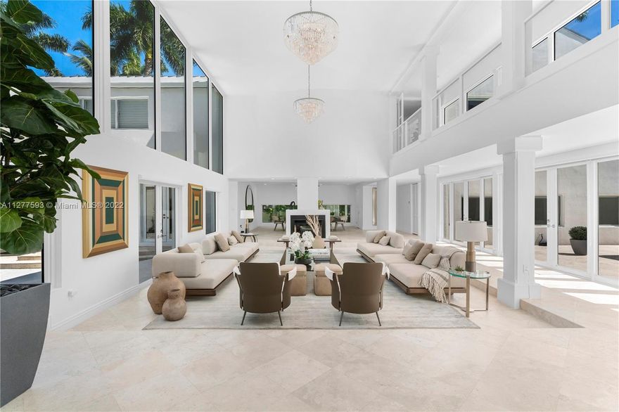 Exquisite home located in the coveted Ponce Davis neighborhood, featuring 8 bedrooms, 8.5 bathrooms, and magnificent living areas. This unique home features a climate controlled wine cellar with 900+ bottle capacity, chef's kitchen, outdoor pavilion with summer kitchen, and heated saltwater pool with Spanish glass tile. Surrounded by lush landscaping and concrete walls, this oasis offers absolute privacy and security. Smart features include ADT Custom Home Pulse (indoor/outdoor cameras, lights, gates, ACs), 40+ solar panels, 2021 60kwt Generac propane generator, 1,250 gallon propane tank, Galvalume roof & PGT impact windows and doors, and electric vehicle charging station. Tastefully staged by Artefacto. Furniture, accessories and artwork available for purchase.