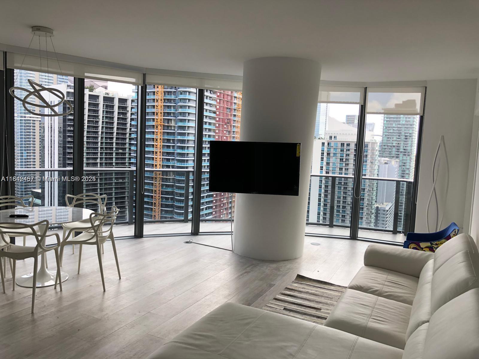 Spectacular FURNISHED 3BD/3BA unit with wraparound balcony, with stunning panoramic water views, Brickell &
Coconut Grove area. Top-of-the-line finishes, quartz countertop, tile-floor throughout, double sink in the master
bathroom, washer & dryer. The newest buildings in Brickell offer elite services & amenities, luxurious shopping, and
fine dining. Indulge in a resort Lifestyle with Theater, Club House, Roof Top Pool, Jacuzzi, sauna, private massage
room, kids playroom, and Green Space for Gardening located in the same building state-of-the-art Equinox Fitness
Club and Spa located at the ground level. SoulCycle indoor cycling studio. Across the street from Brickell City
Centre and steps away from Mary Brickell Village. EASY TO SHOW.