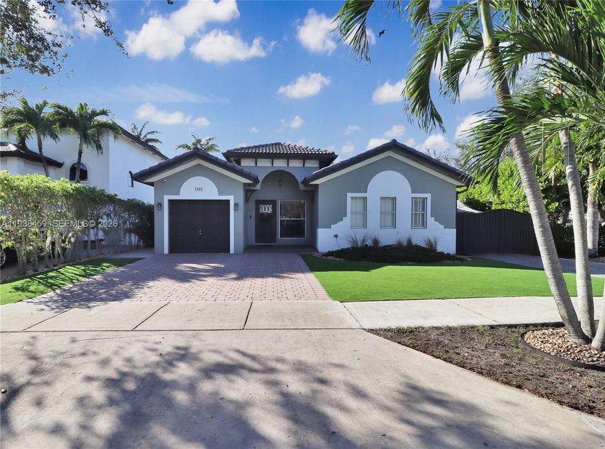 Discover this West Kendall gem featuring modern upgrades. The interior showcases sleek porcelain tiles throughout the main living areas, complemented by warm wood-like laminate flooring in the bedrooms. Elegant crown moldings lead into a fully updated kitchen complete with quartz countertops, a stylish backsplash, and recessed lighting. Both bathrooms have been tastefully modernized. For added peace of mind, the home is equipped with impact-resistant front and back doors. The exterior is an entertainer's delight, featuring a pergola overlooking a refreshing pool and ample side space for parking a boat. This move-in-ready home combines comfort, style, and utility in a highly sought-after location.