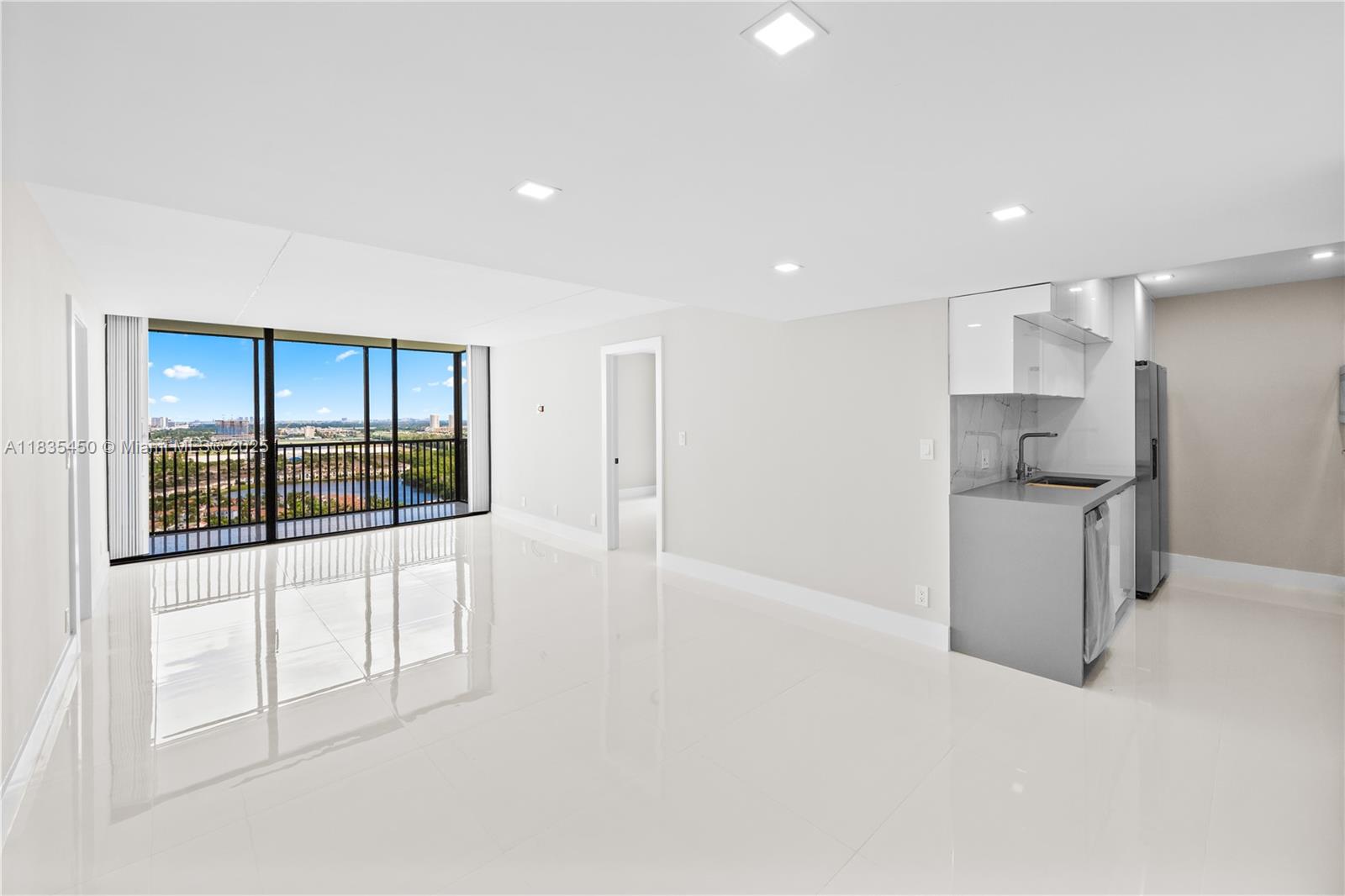 Step into sophistication with this renovated 26th-floor unit. 2 bedrooms and 2 baths, this residence offers panoramic views of the Turnberry Golf Course, Intracoastal, and ocean. The unit is renovated with luxurious finishes, top-of-the-line stainless steel appliances, flawless grey quartz countertops, a striking white backsplash, and elegant 32x32 porcelain flooring and an equipped with a brand-new AC system, this unit ensures comfort and style. Coronado is undergoing a modernization with upgraded elevators, lobby, and hallways, and has successfully completed its 40-year certification. Enjoy resort-style amenities such as a fitness center, sauna, heated pool, jacuzzi, 24-hour security, water (hot/cold), internet, and cable. Rental allowed after one year of ownership. Easy to show!