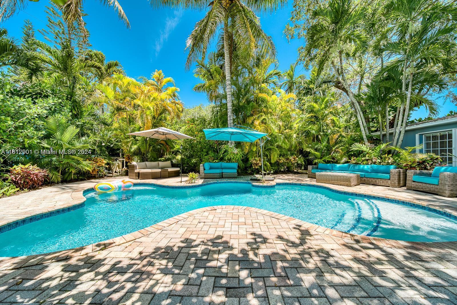 A stunning 3-bedroom, 4-bath home located just 5 minutes from the University of Miami. This fully furnished home is perfect for families seeking an ideal location. Experience true tropical paradise with a private professional putting green. and a heated pool. The spacious, lushly landscaped yard features outdoor lighting and speakers with Bluetooth connectivity. Amenities include a heated pool with umbrellas, a gas barbecue, a fully covered outdoor bar, a putting green and ample outdoor seating for all your guests. Inside, the home boasts a split floor plan with 3 bedrooms and 4 bathrooms. A workout area is equipped with a Peloton bike, resistance bands, and Bowflex weights. Flexible leasing options are available, including month-to-month or a 6-month lease.