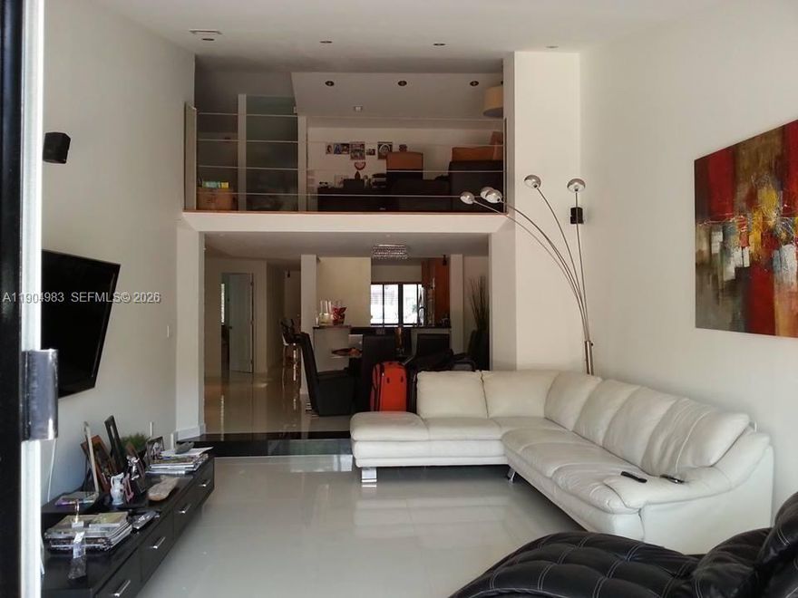 Beautiful 2-bedroom, 3-bath townhouse with a spacious loft. Features a huge designer kitchen with stainless steel appliances, high ceilings, and elegant tile and wood flooring throughout. Includes washer and dryer inside the unit and a large private patio with storage. Recent updates: new roof, A/C (2020), tankless water heater (2014), and updated electrical wiring (2014). Conveniently located near local shops, the freeway, and the beach. Welcome to your new home.