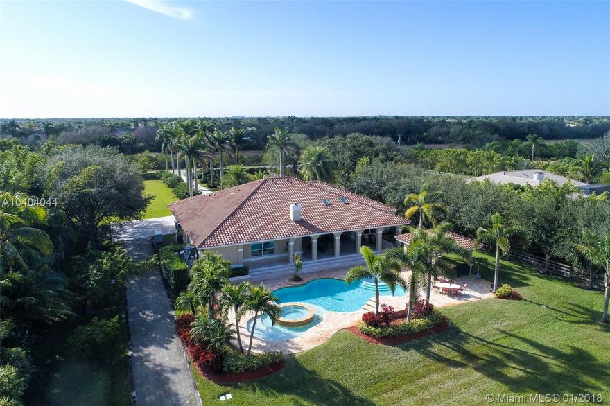 ENTER THROUGH THE PRIVATE GATES & TREE LINED DRIVEWAY TO THE HOME OF YOUR DREAMS IN SOUGHT OF SOUTHWEST RANCHES. THIS CUSTOM BUILT 5BED, 5.5 BATH HOME SITS ON 2.3 ACRES OF WONDERLAND.FALL IN LOVE THE MOMENT YOU OPEN THE DOUBLE DOORS AND ARE WELCOMED BY A 16 FOOT CEILING LIVING ROOM & WALLS OF GLASS LEADING TO YOUR PRIVATE PIECE OF PARADISE.THE INTERIOR SPACES, ALL W/ MARBLE FLOORING, OFFER THE MASTER SUITE & PRIVATE OFFICE ON THE LEFT WING & 4 BEDROOMS ON THE RIGHT. GOURMET KITCHEN OPENS TO A BREAKFAST AREA & LARGE FAMILY ROOM. THE OUTSIDE LIVING AREA IS OUTFITTED W/A COVERED TERRACE, SUMMER KITCHEN, HEATED RESORT STYLE POOL & LOTS OF GREEN LUSH LANDSCAPING. NEW ROOF, IMPACT GLASS. 45K GENERATOR. 1000 GALLON PROPANE TANK. ADDITIONAL 5 CAR GARAGE.WELCOME TO YOUR PEACEFUL & PRIVATE ENCLAVE.