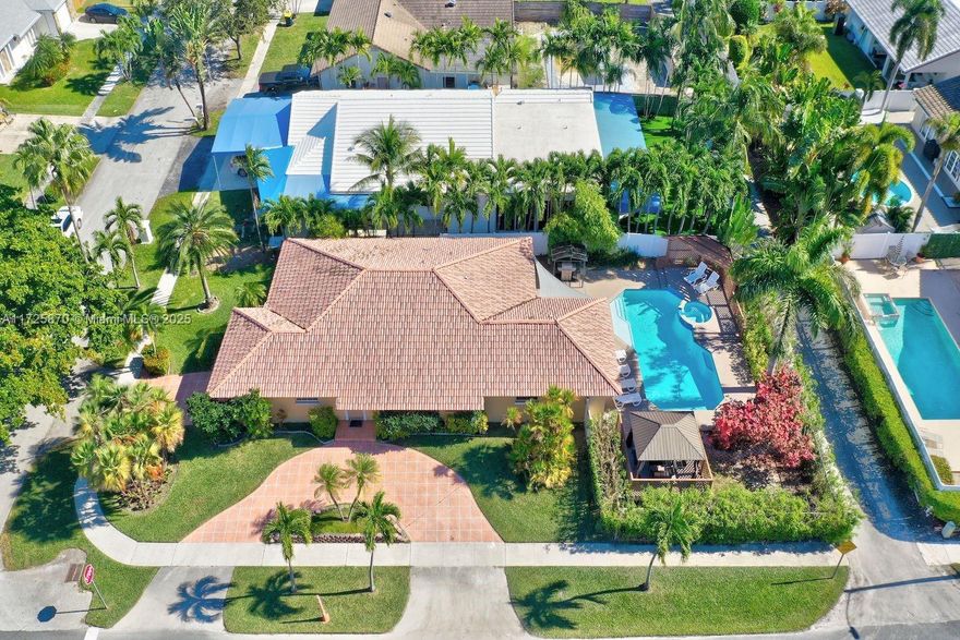 Stunning corner-lot home located in the most upscale part of Dania Beach, offering luxury living and incredible investment potential. This beautifully maintained property features a private heated pool & jacuzzi with a recently installed energy-efficient pool heater, perfect for year-round enjoyment. Situated on a corner lot, the home provides enhanced privacy and abundant outdoor living space. The property boasts 2 driveways, providing ample parking and a charming pergola in the backyard. Fully equipped with short-term rental licenses, this property is ideal for those seeking a lucrative investment or part-time residence. Located minutes from the famous Dania Beach, Hollywood Beach & Boardwalk, the Dania Beach Casino, as well as a variety of restaurants, bars, and entertainment options.