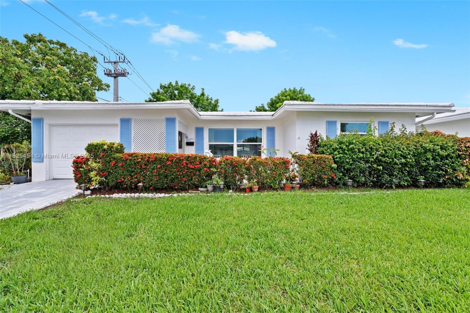 Fall in love with this updated 2-bed, 2-bath single story home in the 55+ Mainlands of Tamarac community! Lots of natural light throughout throughout this larger model ranch-style home. Tile or wood laminate floors throughout - no carpet and newer hurricane impact windows (replaced in 2020). Relax on the back patio while enjoying water views and the the shade of the mature avocado tree and two ackee trees. Amenities include community pool and clubhouse. HOA covers lawn care, exterior paint, and roof cleaning. Per HOA guidelines, 55+