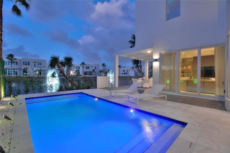 Luxury living at its finest in The Mansions, Doral! This exquisite 5 Beds, 5 1/2 Baths turn-key home is located in one of Doral’s most prestigious gated communities. Designed by Casa Q, this former-model home offers modern luxury throughout with elegant interiors, top-brand furnishings, and appliances, and a gourmet kitchen. The home is an entertainer delight featuring an oversized rooftop, with turf, a fully equipped summer kitchen, a jacuzzi, and breathtaking panoramic views. The backyard is equally impressive, with lake views, a private pool, and a second summer kitchen for outdoor gatherings. Enjoy the luxurious community amenities including a clubhouse, fully equipped gym, playground, party area, sauna, and spa.—Don’t miss the chance to make this spectacular turn-key home yours!