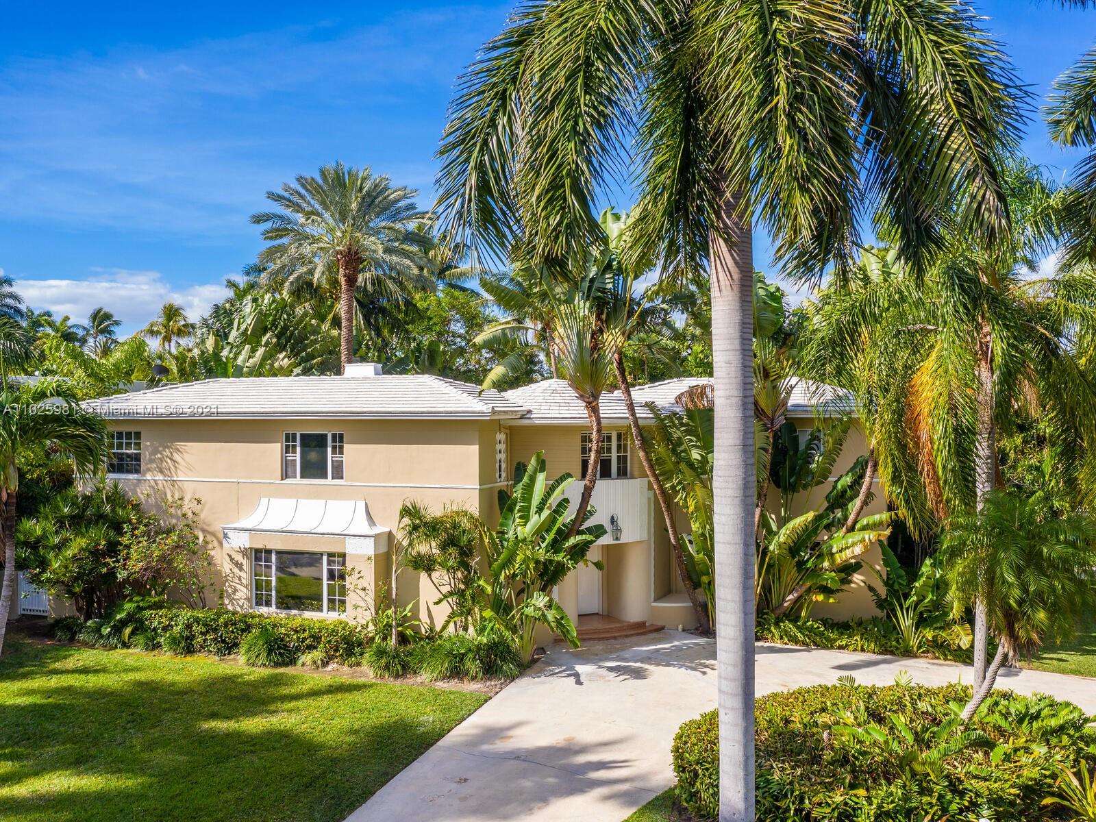 Fabulous 5 Bed/5.5 Bath Art Deco home on prestigious 24 hour guard-gated Sunset Island 2. Home is designed by famed architect Coulton Skinner. Location could not be better since it is located on a corner lot across from Sunset Island 2 park. The foyer boasts a show-stopping curved staircase with high ceilings and marble floors. Spacious gourmet kitchen with custom wood cabinetry, top of the line appliances, and a huge granite center island. Formal dining room, family room, spacious formal living room, and library with dark wood built-ins. Four bedrooms upstairs and one bedroom downstairs. Master has a large walk in closet. Hardwood floors upstairs. Gorgeous landscaped backyard with Brian Van Bower designed pool with fountains, waterfall, jacuzzi, fireplace, and outdoor shower.