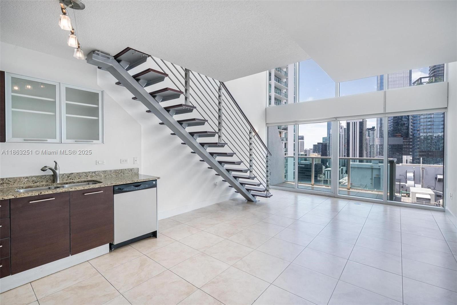 Beautiful two-story loft located on the 17th floor at Brickell on the River. Expansive double-height ceilings with floor-to-ceiling windows create a bright and open space with incredible city views day and night. 1 bed/1.5 bath floorplan with living, dining, kitchen, and half bath on first floor. The second floor features the primary bedroom, bath, and washer & dryer. Amenities include two pools, fitness center, spa, valet, and more. Located in the heart of Brickell just steps away from world-class shopping, dining, and entertainment