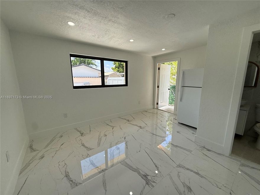 These fully renovated 1-bedroom, 1-bath efficiency units feature a living room, kitchen. Include assigned parking for a car, water, electricity. The unit accommodates up to 2 people. A background check is required, along with the first month's rent and one security deposit. No eviction, history and credit check are necessary. Ready for immediate move-in. This rental has a private entrance and is located in very good neighborhood of Westchester near expressway, great schools, good restaurants, shopping centers, and supermarkets.