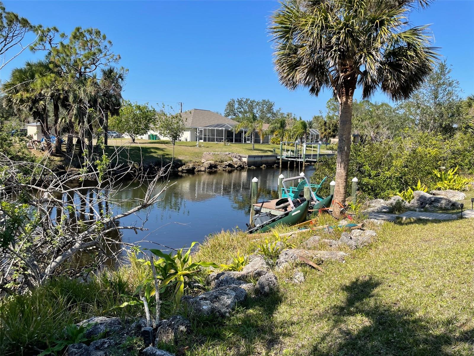 Waterfront Lot. Build your new Dreamhouse here in Port Charlotte - This East facing uncleared plot is ~20,000 sq
feet and there are new homes being built in the community Yes. You. Can. Live on the water! Only minutes from
great sandy Beaches, tasty Restaurants, Shopping, World famous Fishing, and many Golf courses, you can enjoy
the Beach bars and Restaurants or get more active Cycling or Walking around trails. Pet friendly area! Great for
boaters