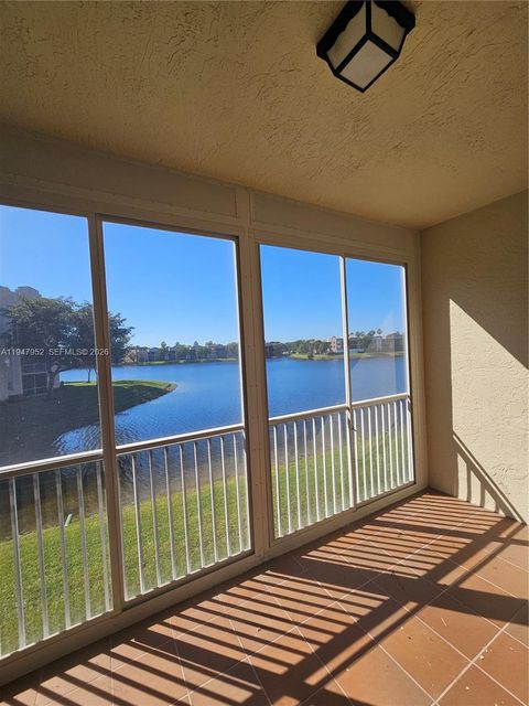 Photo of 7715 Southampton Ter #201E, Tamarac, FL 33321 (MLS # A11947952)