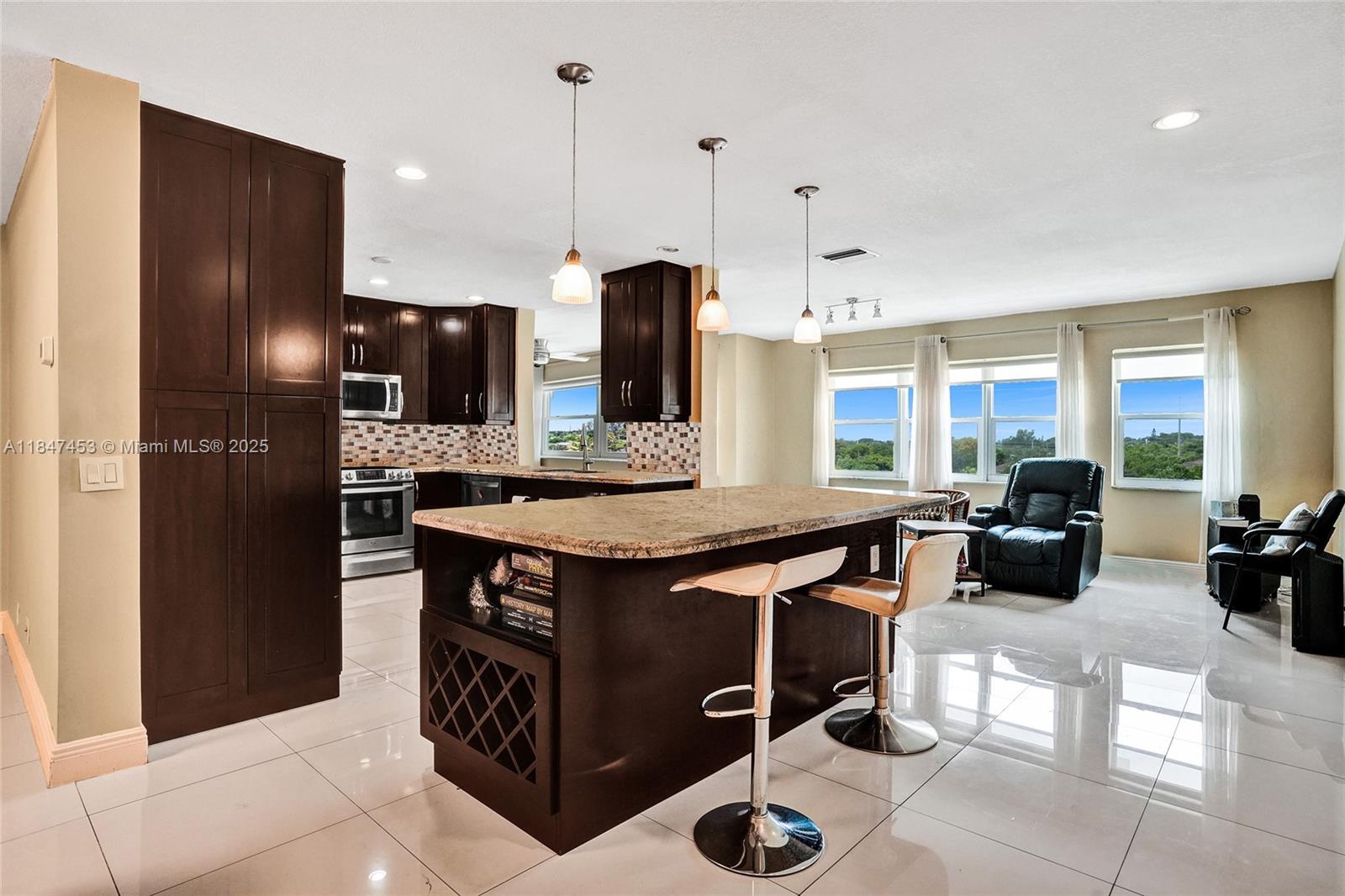 Chic 55+ Penthouse Condo in Hallandale Beach – Perfect Location! Experience comfortable living in this top-floor, 3-bed, 2-bath penthouse condo located in a desirable 55+ community. Featuring an open kitchen with granite countertops, stainless steel appliances, and elegant tile flooring, this move-in-ready unit also includes a private terrace for enjoying beautiful views. Impact windows, in-unit laundry, central A/C, Beautiful pool, clubhouse, sundeck, BBQ area, and friendly neighbors. Perfectly situated directly across from the police station and near Aventura Hospital. Just minutes to Aventura Mall, dining, shopping and walking distance to the world-famous Gulfstream Racetrack and Casino. Only 5 minutes from the marvelous Hallandale Beach! Schedule your private showing today!