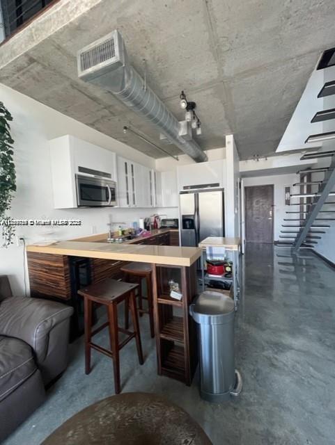 Fully furnished 1-BR loft unit available at Neo Vertika Condominium. Excellent opportunity to lease a fully equipped unit in the desirable Brickell neighborhood. This two-level loft-style unit features spectacular views of the Miami river from both the downstairs and upstairs balcony. Unit features polished concrete floors throughout, open kitchen concept, washer/dryer inside, and high ceilings for a truly spacious feeling. Neo Vertika is located in an ideal pocket on Brickell just along the Miami River. Building features a generous pool deck, gym, dojo, boxing gym, steam/sauna, dog park, basketball area, & one of the coolest and most artistic lobby's in all of Miami. Not to mention an excellent bar/restaurant within the complex ; American Social. Available for occupancy on Sept. 15, 2025