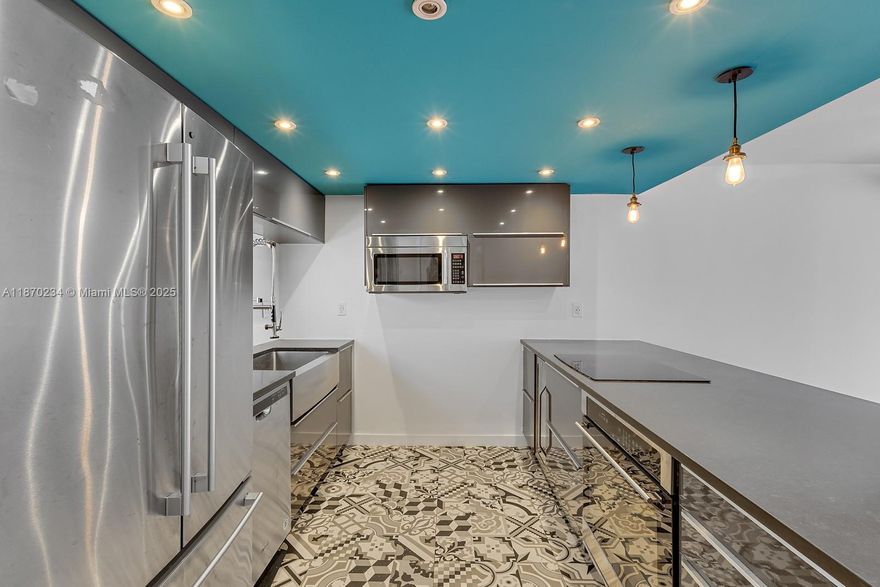 Completely Remodeled 2BD/2BA with split floor plan and serene views of Ocean Lane Dr. Features hardwood and tile flooring, impact windows, and stylish finishes throughout. Located in a pet-friendly, open-air building with private beach access just steps away. Includes 1 covered parking space plus ample guest parking.