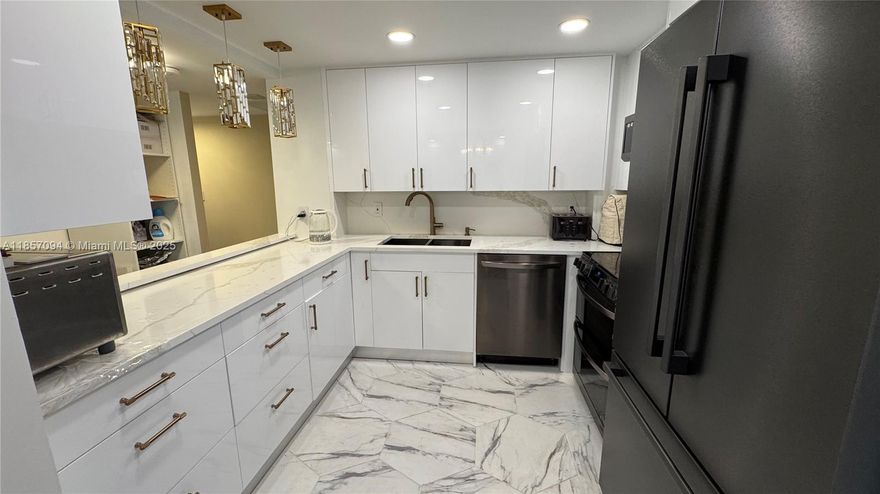 Elegant 2-Bedroom, 2-Bath Residence on the Intracoastal. First time available on the market, this spacious residence offers a refined living experience with a classic, tastefully executed renovation. The kitchen features timeless cabinetry, premium stainless steel appliances, and elegant finishes, while both bathrooms have been thoughtfully updated with enduring style in mind. Enjoy the comfort of a well-maintained building with a wealth of amenities, including a waterfront pool, on-site restaurant, fitness center, and more