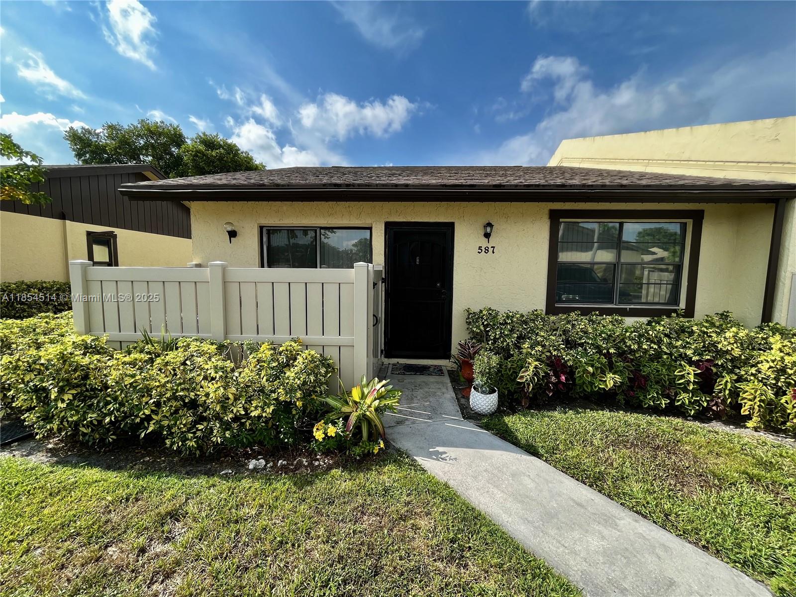 LAKEFRONT CORNER UNIT 2/2 villa at Woodlake Isles with spacious bedrooms and your own personal dock! Located in prime location with scenic views from front and backyard. Features an open floor plan, split bedrooms, ceramic tiles, lots of natural sunlight, walk in closet, & impeccably maintained. Comes with 2 assigned parking spots and guest spaces throughout the neighborhood.