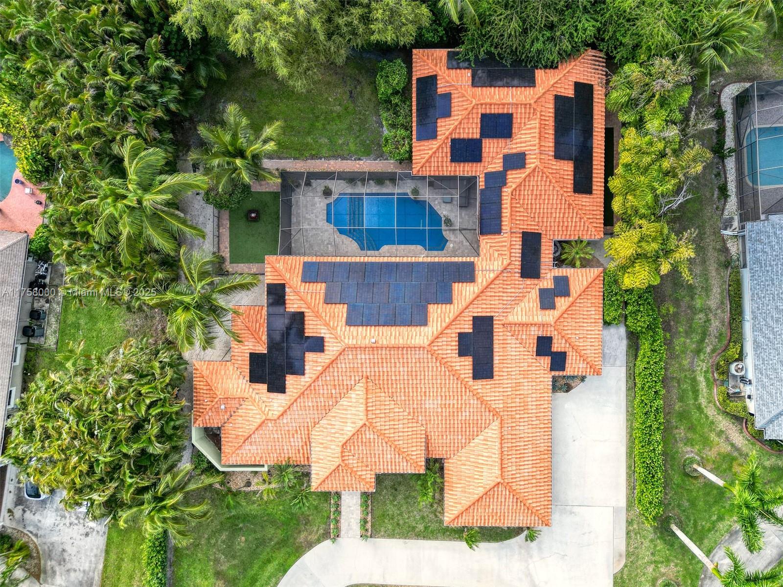 Discover this exquisite Mediterranean-style estate in the sought-after community of Meadow Wood. You are greeted by a grand circular driveway surrounded by lush landscaping. The thoughtfully designed floor plan features high ceilings and arched windows, creating a bright atmosphere, filling the space with natural light. It includes multiple bedrooms, bathrooms, and a private mother-in-law suite. The chef's kitchen is equipped with modern appliances, generous cabinetry, and stylish finishes. Step outside to a tropical paradise in the backyard, complete with towering palm trees and ample space for outdoor gatherings around the pool. This oversized lot offers privacy and tranquility. Ideally situated just minutes from beautiful beaches, dining options, shopping, and highly-rated schools.