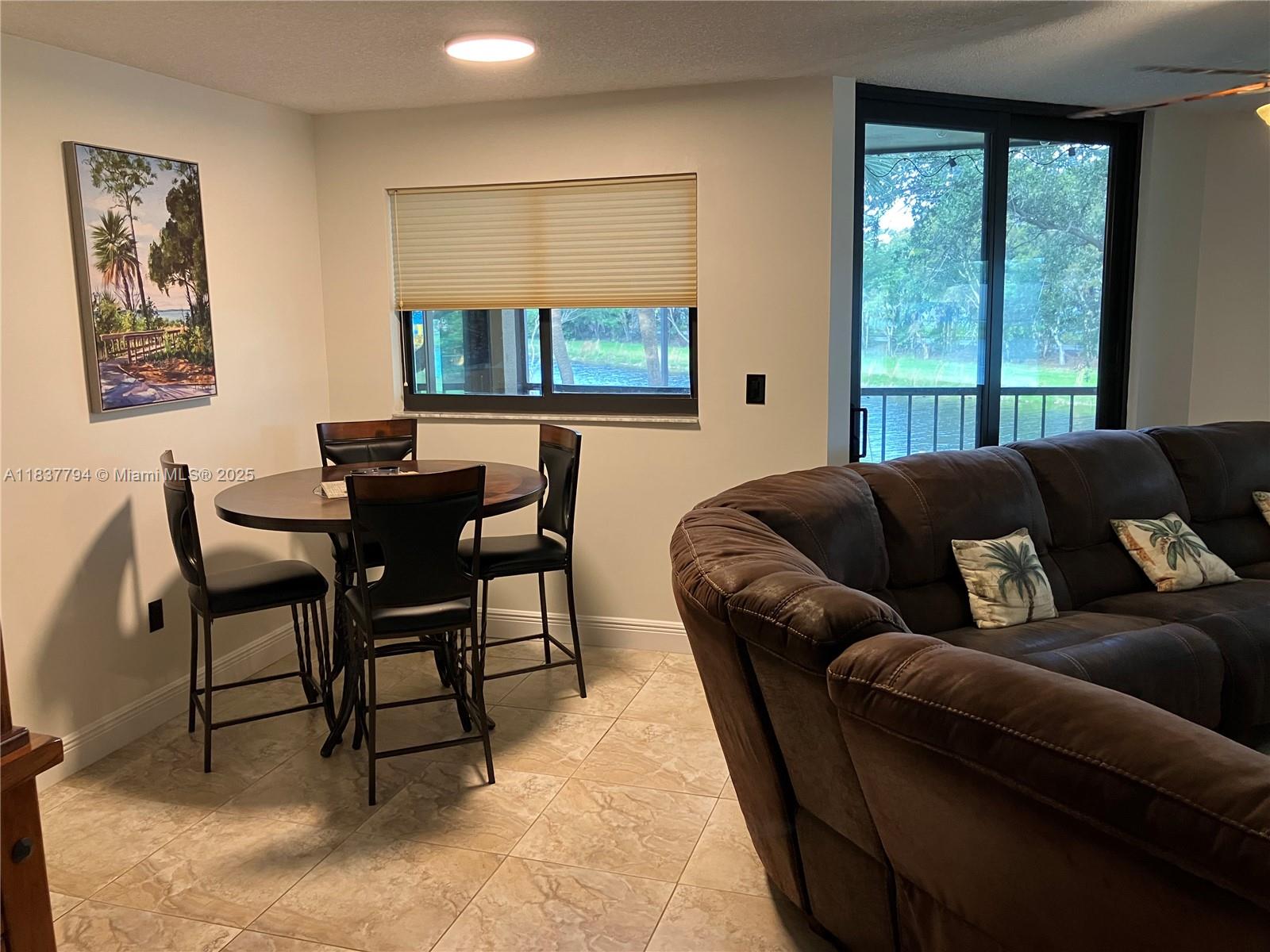 Modern and bright lakefront condo available at Celebration Point! This 2-bedroom, 2-bathroom corner unit features tile floors throughout and a split floor plan with spacious bedrooms, each offering a walk-in closet. The kitchen has been upgraded with stainless steel appliances. Celebration Point is centrally located in the heart of Miami Lakes, offering easy access to dining, shopping, and top-rated schools.