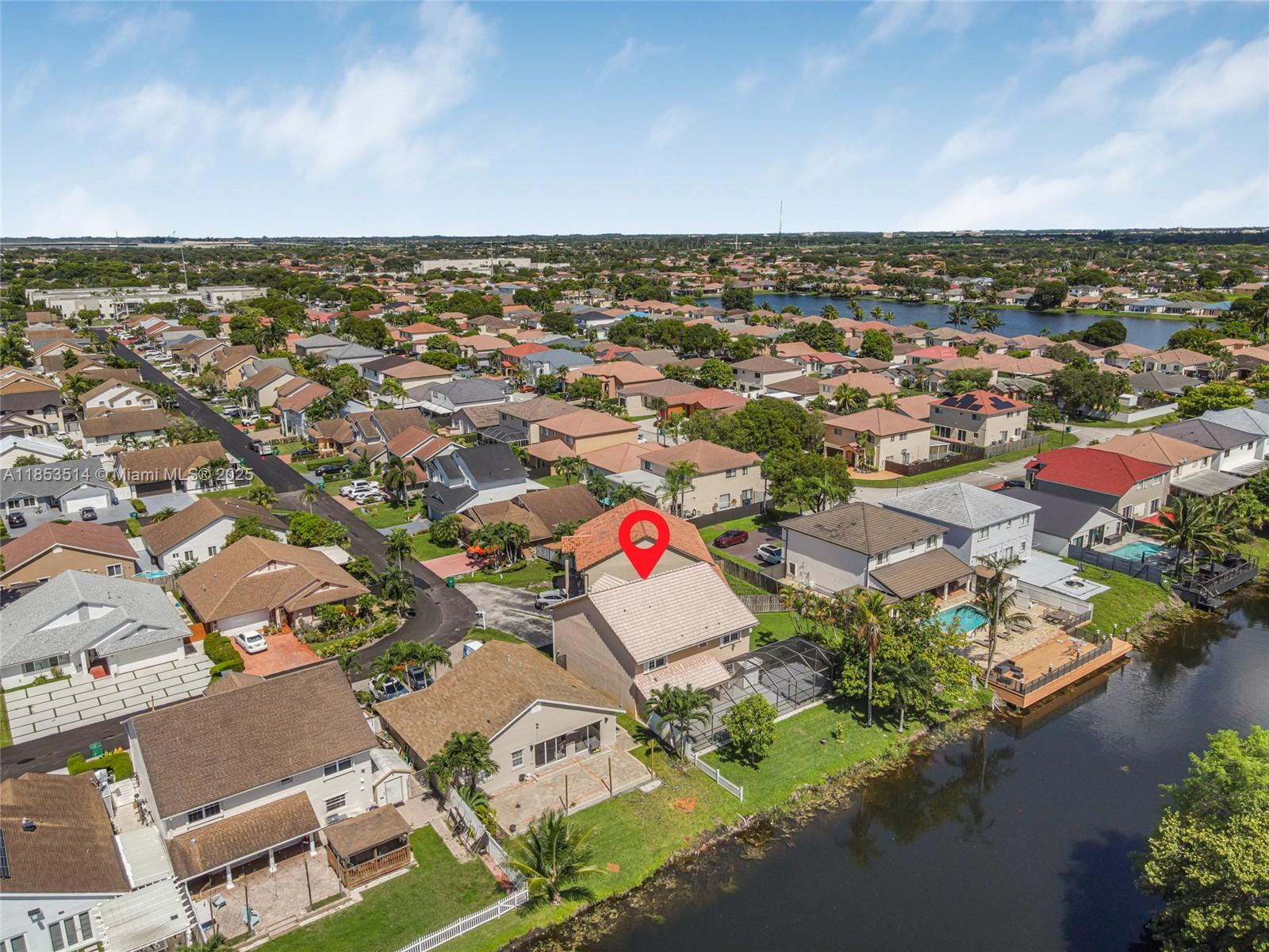 This incredibly spacious canal-front home is located in the desirable Esplanade community. Perfect for a large family or as an Orlando-style Airbnb. Features Italian tile floors in the formal living room and kitchen/family room areas. You will love the huge master bedroom/walk-in closet and master bath. The $25K master bath was remodeled with high-end finishes. ***The home was re-piped 10 years ago (no more Polybutylene)**** A soft water system was installed. The interior has been freshly painted and the barrel tile roof was just pressure cleaned. Low HOA for common area of community pool and clubhouse. Other highlights include a vaulted screen room, high-end $30K composite deck, solar lamps, room for a pool, furnished office with canal view! AHS warranty included!