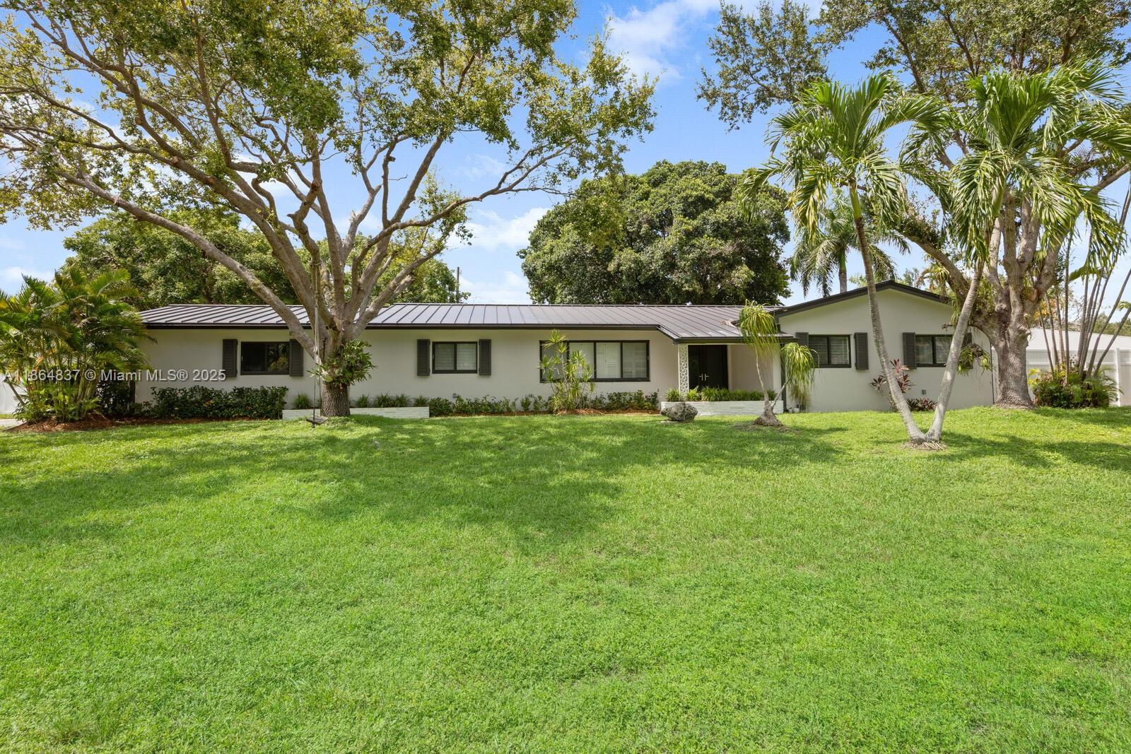 Beautifully updated 3/2 Palmetto Bay residence, featuring new kitchen and appliances, impact windows, metal roof, updated bathrooms, private fenced back yard, covered terrace, freshly landscaped, formal dining, family room, and living room, plus a 2-car garage. Pool and yard maintenance are included in the rent. This home features spacious living areas, abundant natural light, and a functional layout in a quiet family friendly neighborhood.