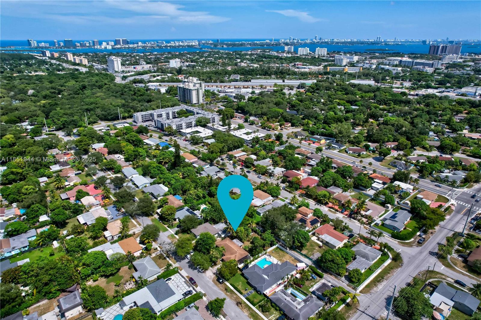 Beautiful opportunity for a single-family home on a spacious nearly 11,000 sq ft lot in a quiet, updated North Miami neighborhood just minutes from Biscayne Bay. Surrounded by mature fruit trees with full east-south-west sun exposure—perfect for a large pool and resort-style outdoor living. Connected to sewer and equipped with a private well for free irrigation water. Great potential to renovate and customize your dream home or build new. Ideally located near I-95, US-1, and the 826, with quick access to Miami Beach, Downtown, and Aventura, plus close to Arch Creek Park, MOCA, Bal Harbour Shops, and Barry & FIU campuses.