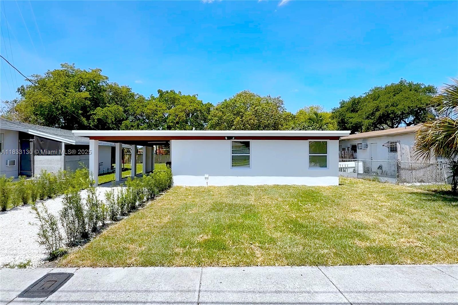 Beautiful 3 Bedroom, 2 Bathroom Newly reimagined with Spacious backyard in a calm neighborhood. Featuring a New Roof, A/C, Electrical, Plumbing, Impact windows & Doors, Appliances and front yard Lawn. Lighting in this home is incredible because of it's sliding door in the living room and it's unique touch that gives you access to the backyard through the Master Bedroom as well. EXTENSIVE LOT ALLOWS you to EXTEND your home or BUILD units as an INVESTOR. Come see it now!
