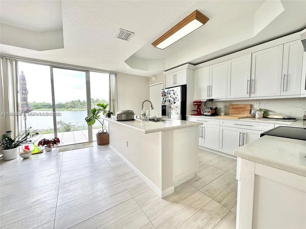 Photo of 10679 SW 6th St #902, Pembroke Pines, FL 33025 (MLS # A11996684)