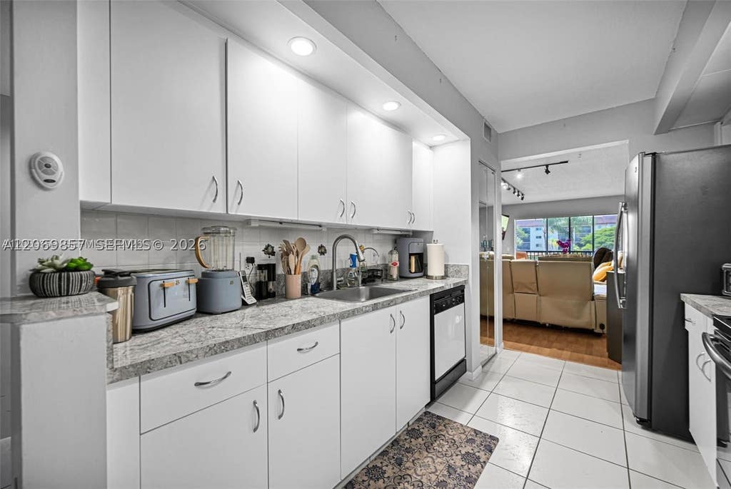 Photo of 12750 SW 15th St #204D, Pembroke Pines, FL 33027 (MLS # A12069857)