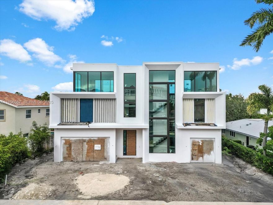 This exceptional, brand-new estate by Yacov Development Group defines modern luxury and architectural grandeur. Located in prestigious Boca Villas, this home offers resort-style living, beginning with a striking foyer with triple-height ceilings leading into an open-concept layout. Inside, five spacious bedrooms are complemented by a formal living room, dining room, office, and a gourmet chef’s kitchen with an adjacent prep kitchen for seamless culinary experiences. The third floor boasts a clubroom with a full bar and expansive open terrace, ideal for entertaining. An elevator provides access to all levels. The outdoor oasis includes a pool, covered patio, and gazebo with an outdoor summer kitchen. Located in exclusive East Boca Raton. Completion early Q1 2026.