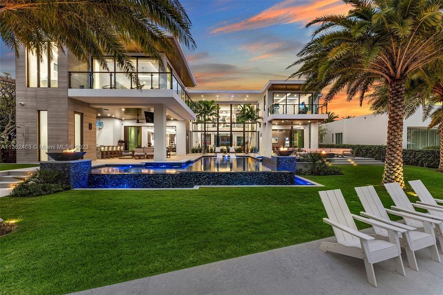 Welcome to this stunning 2021 new construction custom-built home, perfectly situated in the best part of Lighthouse Point and boasting 7,725 sqft of living space and an impressive 10,848 total. This modern masterpiece offers 107' of breathtaking waterfrontage, making it a boater's paradise, while an oversized 15,718 sqft lot provides ample outdoor space. With 5 bedrooms, 5.5 bathrooms, an outdoor shower, pool with bar, huge covered space, gym, game room, loft, office, and a four-car garage, this completely custom-built home spared no expense in its design and construction. The open-concept living areas feature floor-to-ceiling windows and sliding glass doors that showcase the unparalleled waterfront views, and the high-end finishes and elegant design provide the ultimate luxury lifestyle