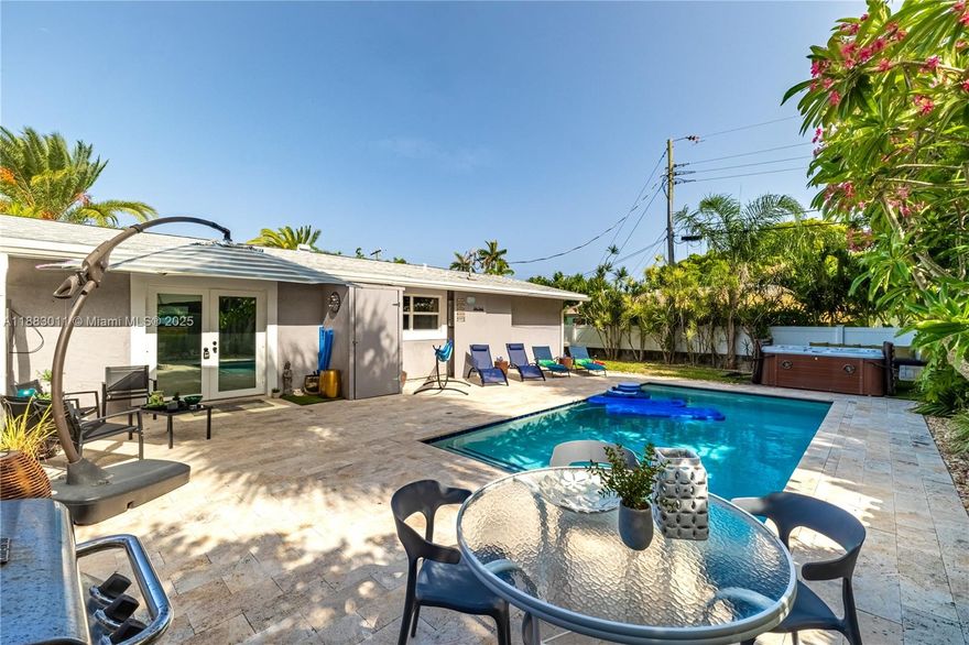 Private tropical escape in the heart of Pompano Beach. Beautifully furnished 2-bedroom, 1-bathroom home is the ideal retreat for a relaxing short-term stay, just minutes from the beach, great restaurants, and shops. The home features two comfortable bedrooms with quality linens and ample storage, one king size bed and one queen size bed, a modern bathroom with shower, and a fully equipped kitchen complete with cookware and dining space for four. Full size washer & dryer. The backyard includes a beautiful pool, separate hot tub, games, lounge chairs and privacy fence all around. Walls are soundproofed for complete privacy. Only available short term. The unit next door is also available for rent and is a 1/1 with its own pool, it is completely private as well.