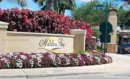 Don't miss the opportunity to live in the prestigious Malibu Bay community! Discover this charming and meticulously maintained gated community with a guard at the entrance. This comfortable floor plan features 2 bedrooms and 2 bathrooms, with porcelain tile throughout. The unit boasts a new granite countertop and includes a washer and dryer for your convenience. Situated on the second floor, in front of from parking and steps of the mailbox. The community offers beautiful common areas, including a swimming pool, gym, walking trails, and more. Located near Publix, Baptist Hospital, and various shops. Vacant and easy to show.