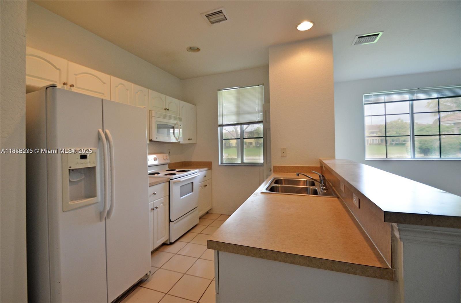 A WARM SOUTH FLORIDA LIVING IS THE ATMOSPHERE @ SAN REMO, BUILT 2007. 2 BEDS 2-1/2 BATH WITH LAKEVIEW. LIVING & DINING FOR THIS 2 STORIES TOWNHOME. MASTER WALK-IN CLOSET. BRAND NEW FLOORING IN THE LIVING ROOM AND BRAND-NEW CARPET IN THE BEDROOMS. COMMUNITY FEATURES POOL, CABANA, CLUB HOUSE, & LOUNGE AREA. CLOSE TO SCHOOL, BUS ROUTE PHARMACY & TURNPIKE. 2 ASSIGNED PARKING SPACES.