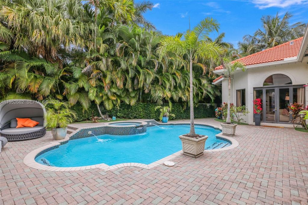 Photo of 10502 Kestrel St, Plantation, FL 33324 (MLS # A11952662)