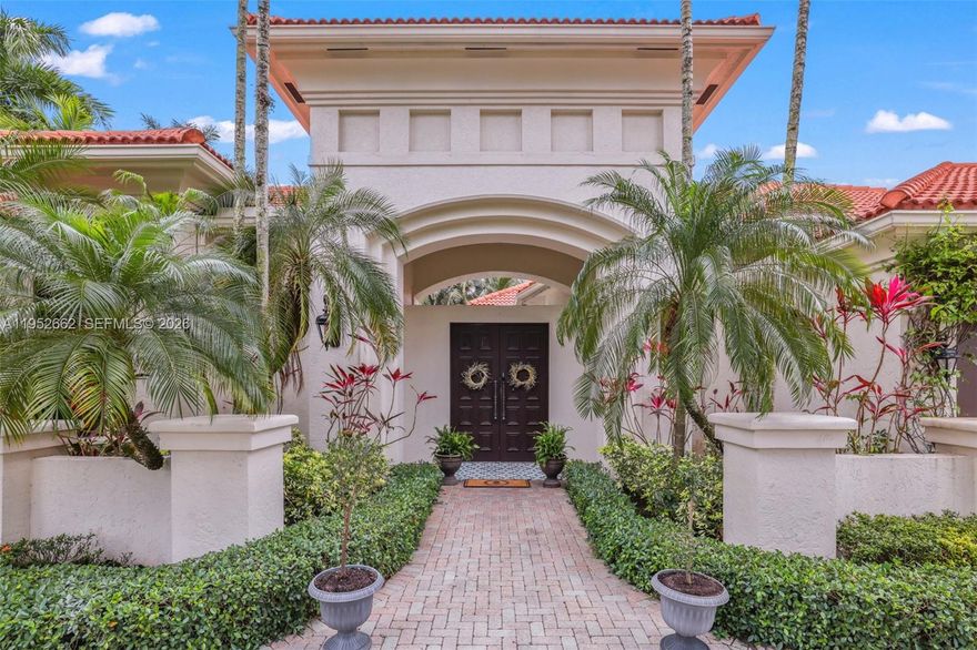 Thoughtfully designed and recently remodeled, this modern 4-bedroom, 4.5-bath courtyard estate sits on a rare oversized inner-loop cul-de-sac lot just under half an acre, offering exceptional privacy and lakefront living. This unique home features both a private interior courtyard and a full backyard on the lake, providing two distinct outdoor living experiences. Located in the prestigious guard-gated community of Hawks Landing in Plantation, the home delivers refined luxury with a resort-style feel. The main residence includes three en-suite bedrooms, two of which are primary suites, plus a powder room, within a desirable triple-split floor plan. Oversized rooms, custom finishes, and abundant natural light enhance the living experience. The chef’s kitchen anchors the home with a gas stove, LG Signature appliances, wine fridge, sleek cabinetry, and seamless flow into the main living areas. A fireplace adds warmth, while impact windows and doors provide comfort and peace of mind. A detached guest house serves as the fourth bedroom with full bath, overlooking the private courtyard—ideal for guests, a home office, or multigenerational living. Outdoor spaces include a heated saltwater pool within the courtyard and serene lakefront backyard with turf landscaping, expansive water views, and total privacy. A rare opportunity to own a luxury courtyard estate with lakefront living in one of Plantation’s premier communities.