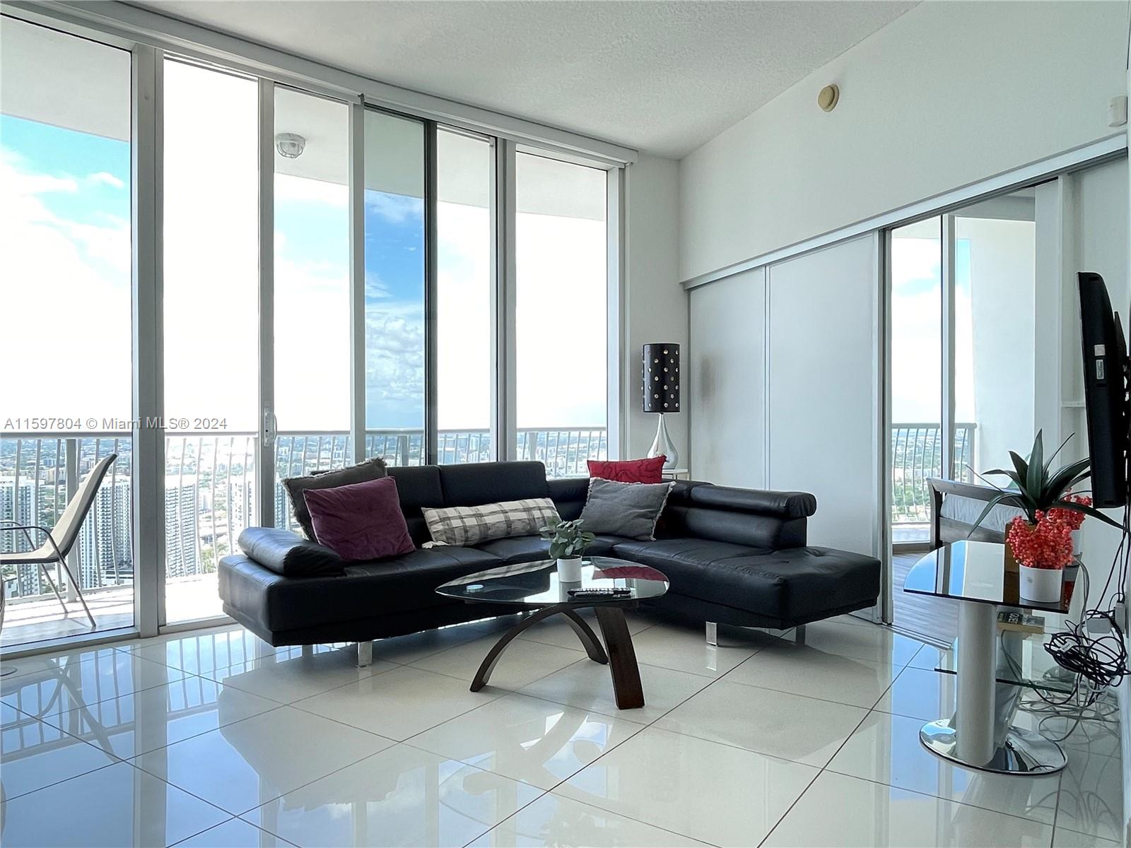 Opera Tower, airbnb-enabled penthouse in Edgewater, Miami! This stunning 2Br and 2Ba penthouse on the 54th floor offers sophistication, comfort, and convenience. It's a great rental investment, allowing Airbnb rentals from 30 days and up. Key features include panoramic views, elegant interiors with new flooring and appliances, a private terrace, and access to hotel-like amenities. Prime location near Margaret Pace Park, supermarkets, restaurants, and more. Minutes from downtown, Wynwood, Design District, and South Beach. Flexible lease options make it an ideal investment or dream home. Don't miss out on owning a unit in Miami's most convenient location. Contact the listing agent to schedule a showing.