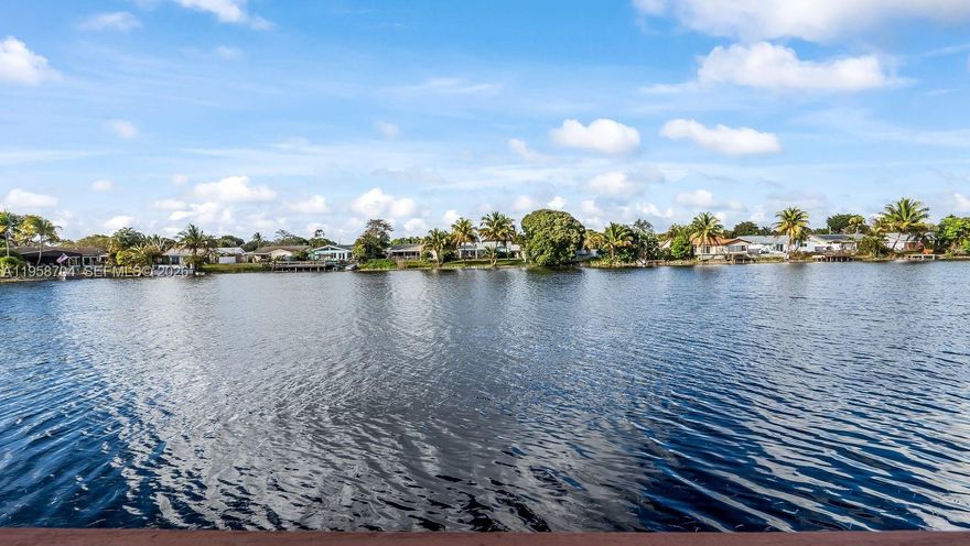 New Roof!!!  How would you like to wake up to beautiful water views every day? This 4/2 Waterfront Pool home is the exception. This multiple Split Floor plan provides lots of space and separation for each person in the home. The 5-car driveway is quite unique and can accommodate many vehicles. The tankless water heater ensures endless hot water for the entire household. Safe & Secure: Peace of mind comes standard with a fully fenced-in yard. Vacation at Home: Spend your Winters and falls in the heated inground pool. It’s the perfect centerpiece for many parties and wonderful memories. Extra Storage: The included outdoor shed is perfect for stowing away bikes, sports gear, and Holiday decorations, keeping your main living areas clutter-free. This isn’t just a house; it’s a lifestyle upgrade. From the safety of the fenced yard to the luxury of the heated pool, and lake views, every detail has been curated to make life easier and more enjoyable.